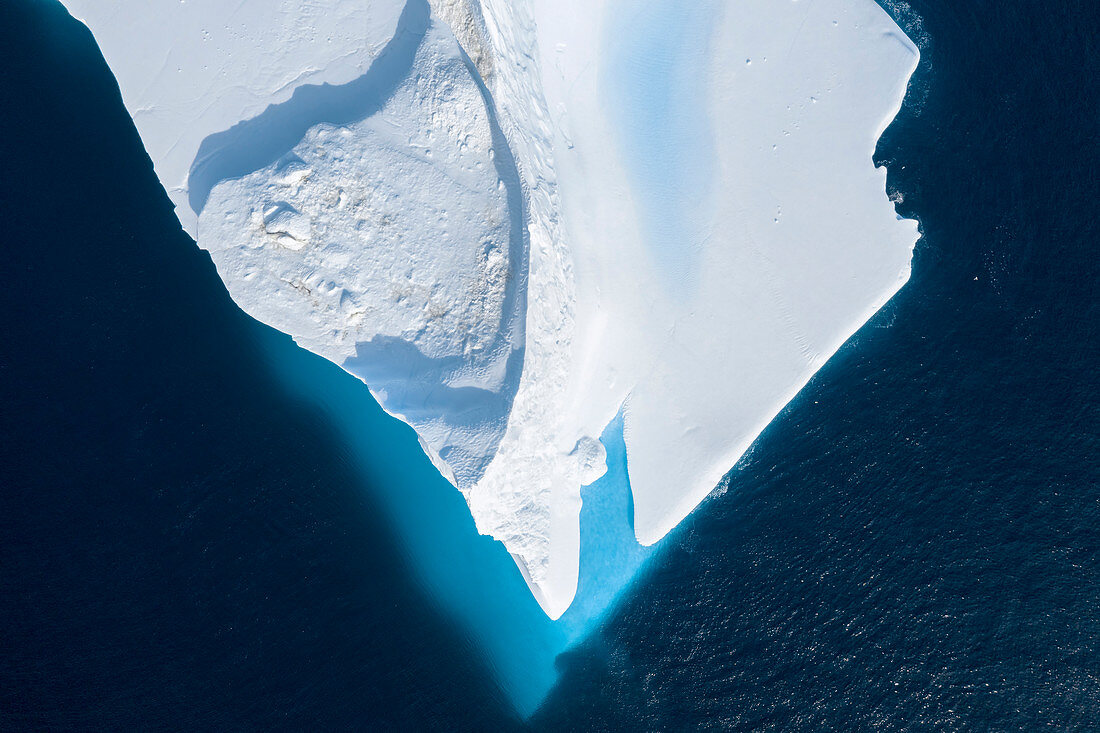 Drone point of view melting iceberg Greenland