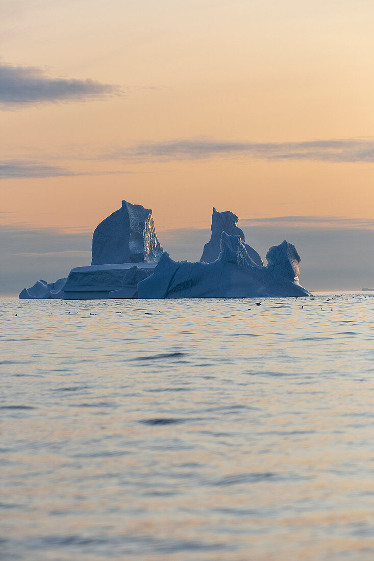 Majestic iceberg formation on Atlantic Ocean at sunset