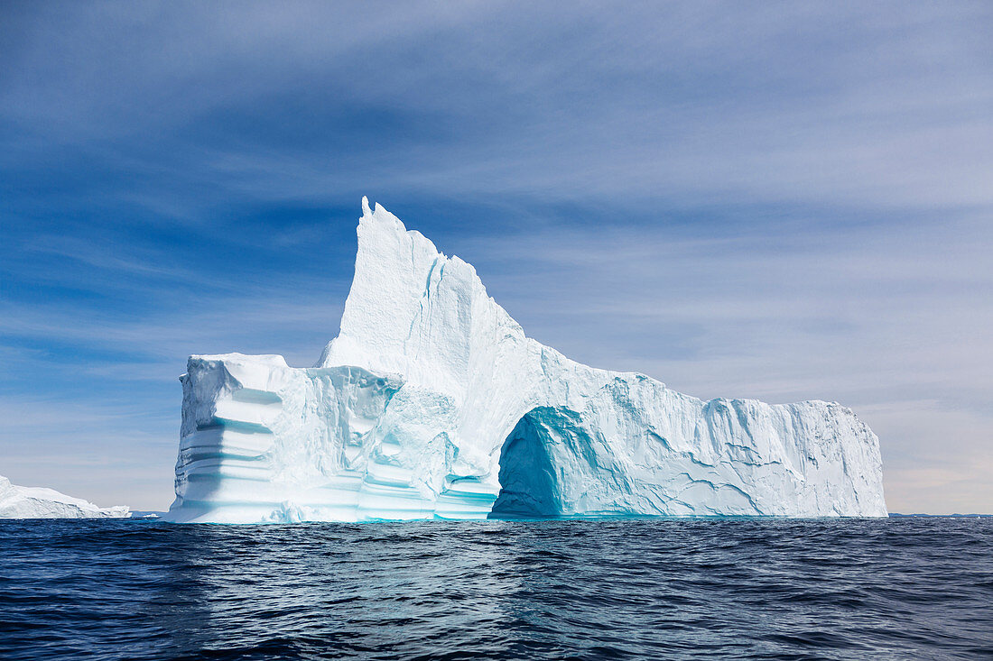 Majestic iceberg with arch