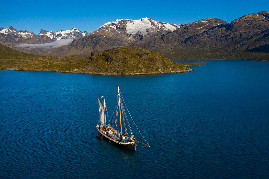 Ship in remote blue Disko Bay West Greenland