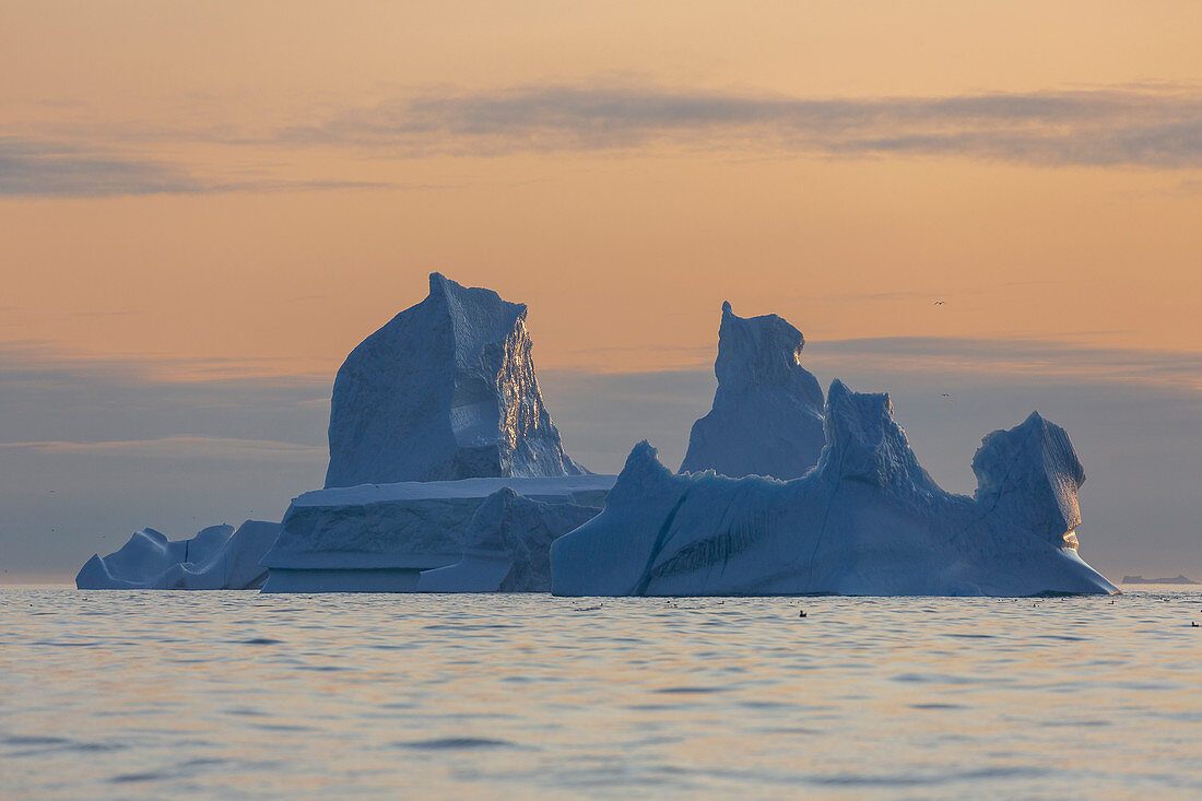 Tranquil majestic iceberg on sunset