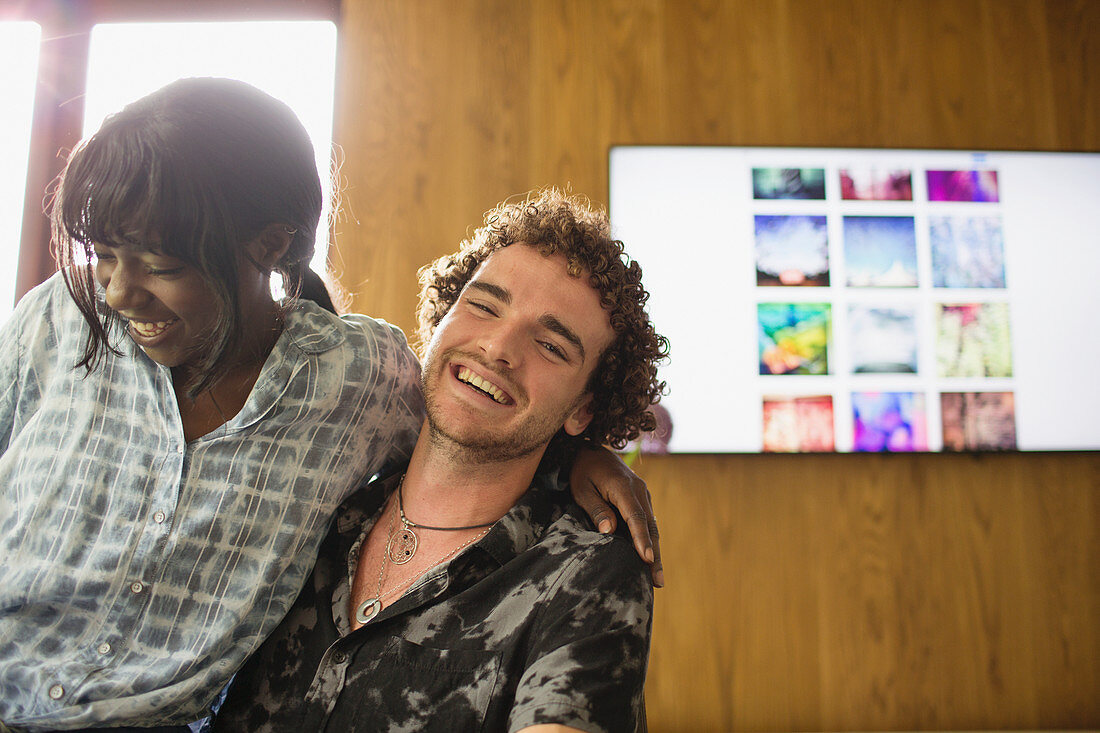 Portrait happy multiethnic couple laughing