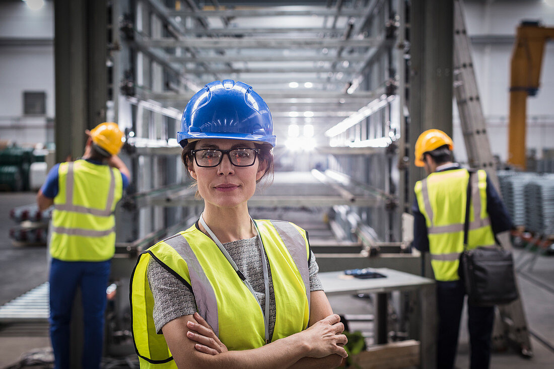 Portrait confident female supervisor in steel factory