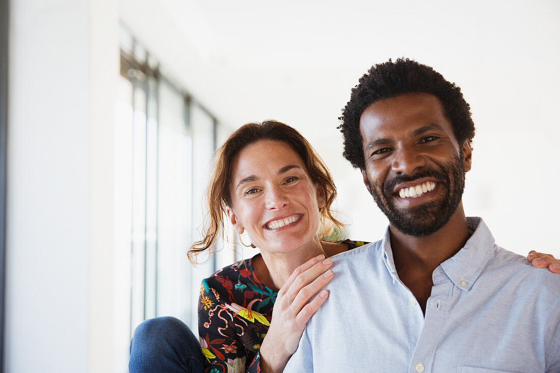 Portrait smiling, enthusiastic multi-ethnic couple