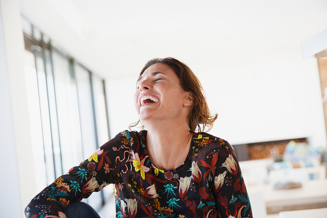 Laughing, happy brunette woman