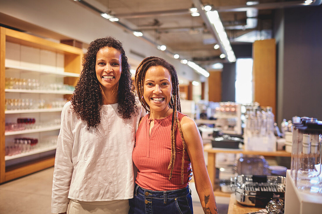 Confident women friends shopping in home goods store