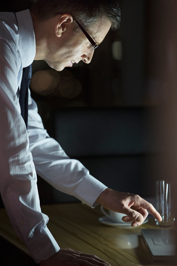 Businessman working late at laptop