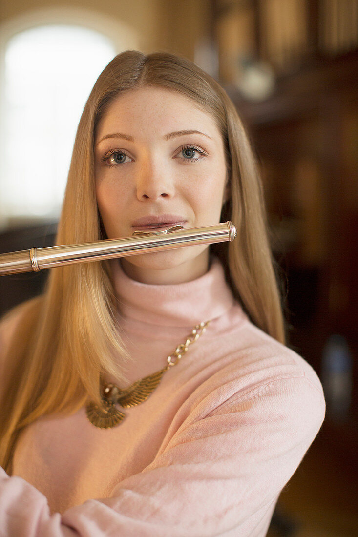 Portrait of flutist performing