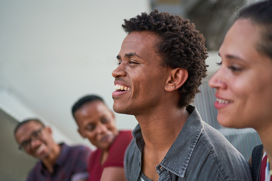 Young man hanging out with friends and laughing