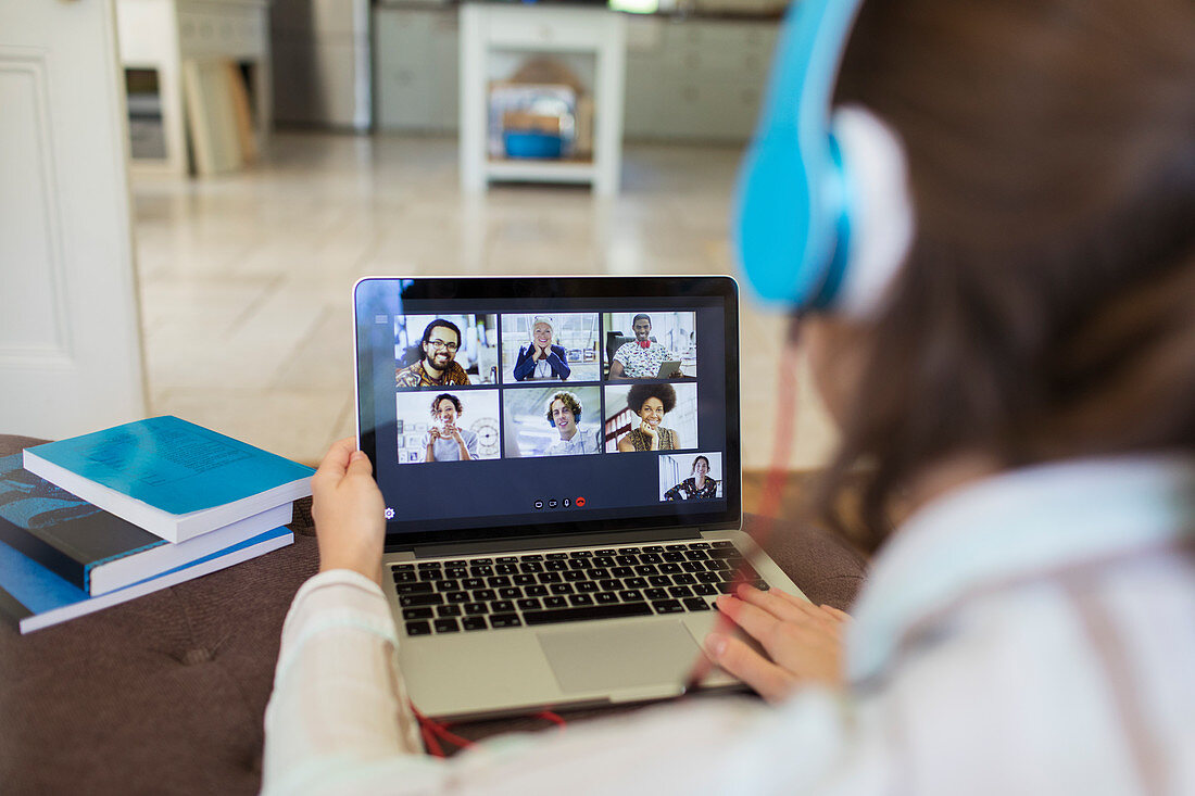 Colleagues video chatting on laptop screen