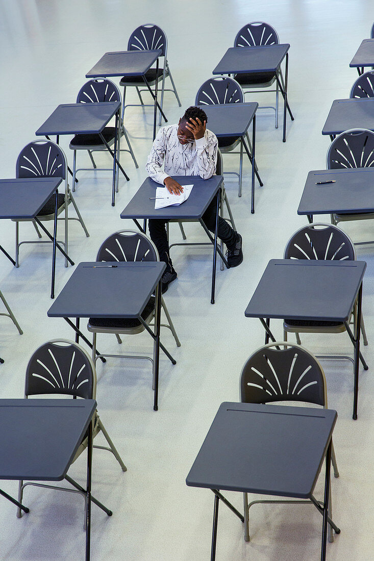 Dedicated boy student taking exam