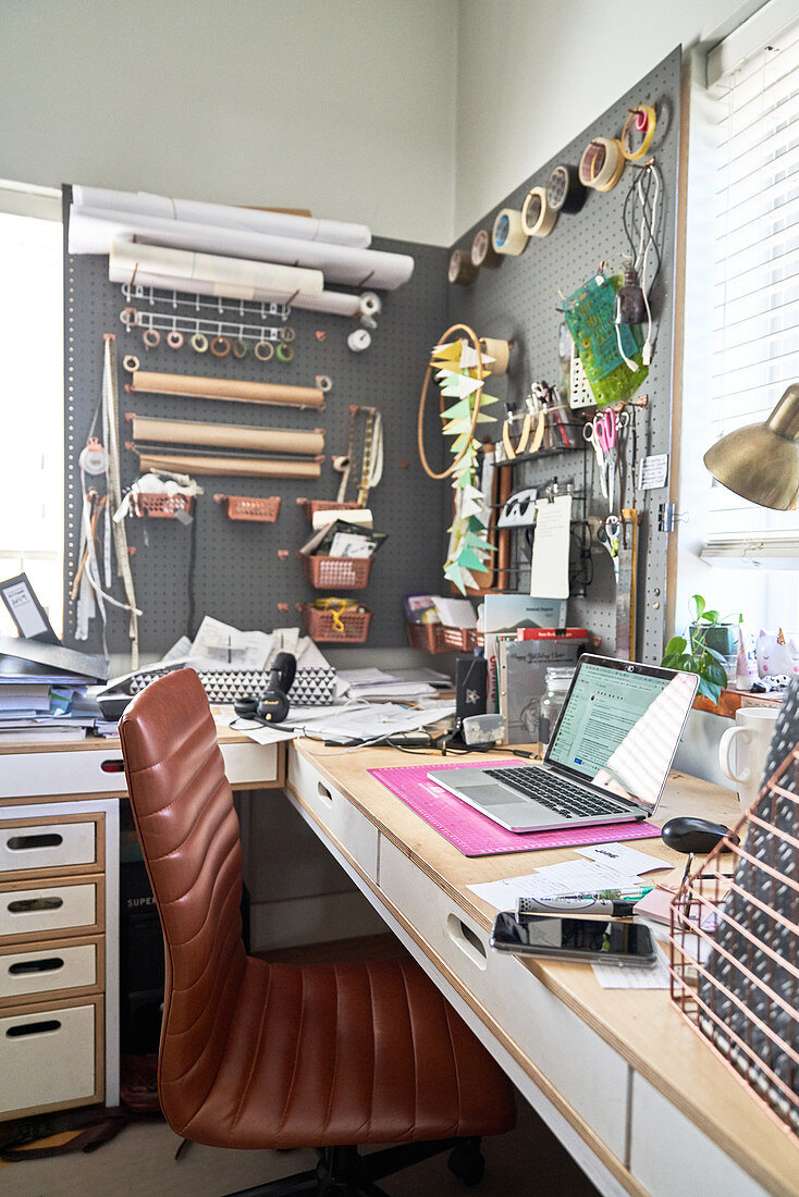 Creative home office with craft supplies