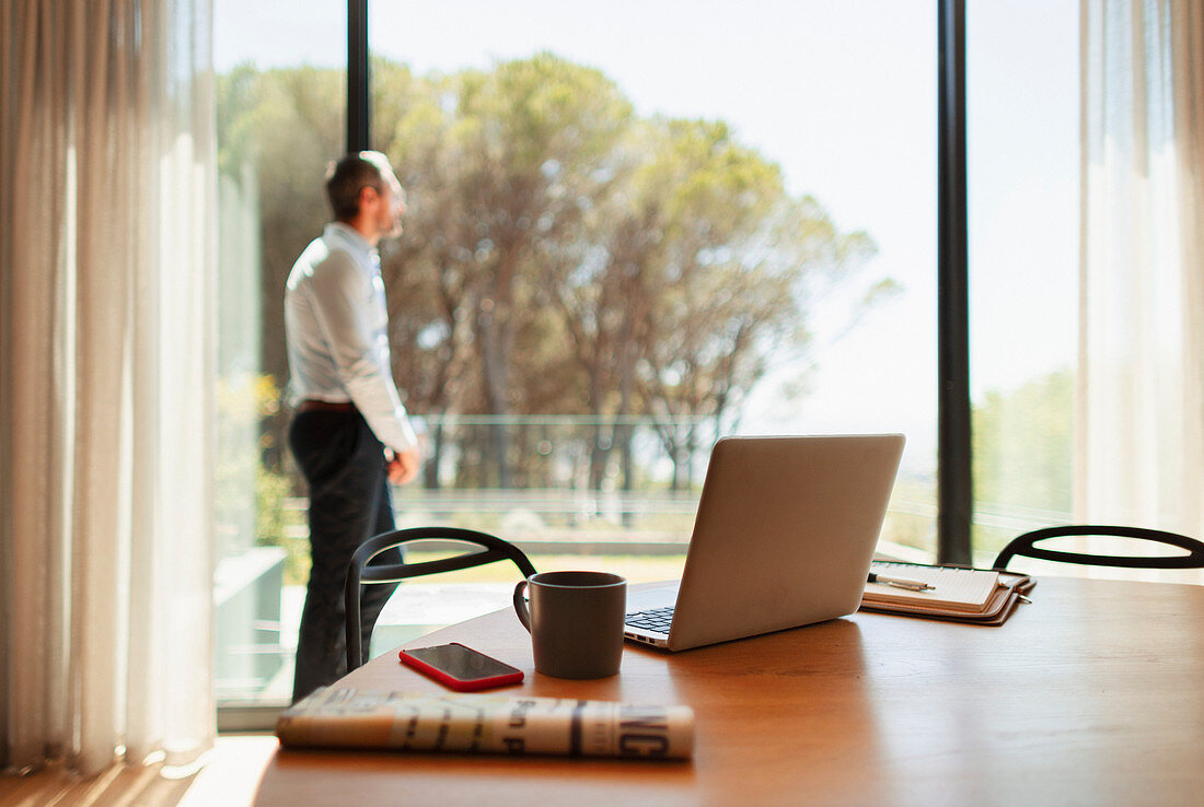 Businessman taking a break from working at home