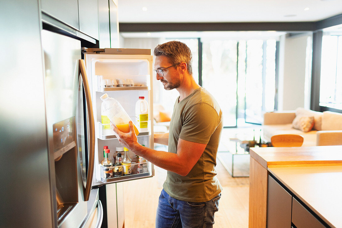 Man holding orange juice