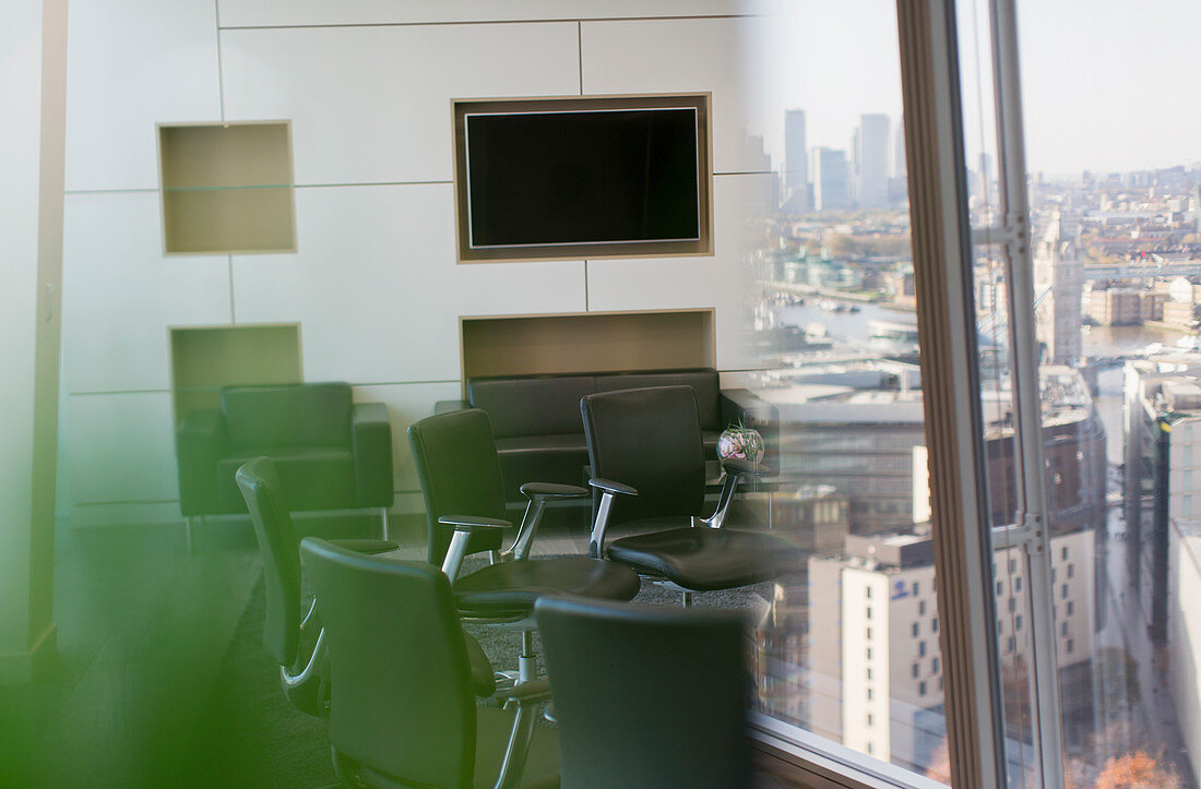Chairs in circle in modern city conference room