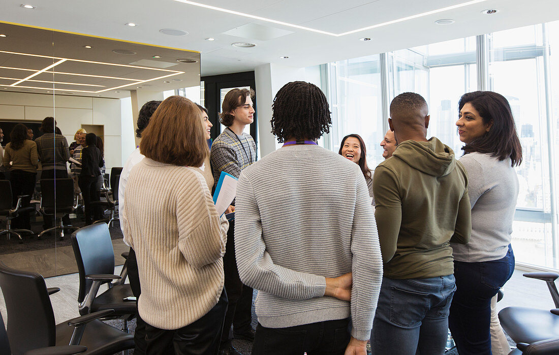 Business people talking in circle