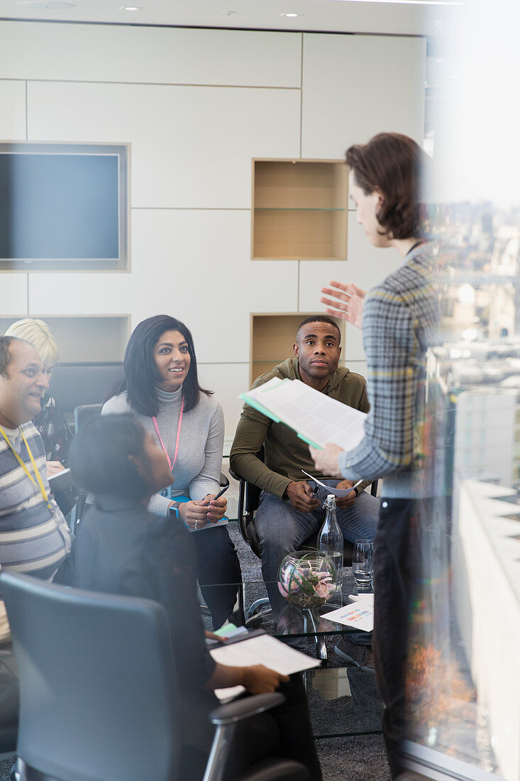 Businessman leading conference room meeting