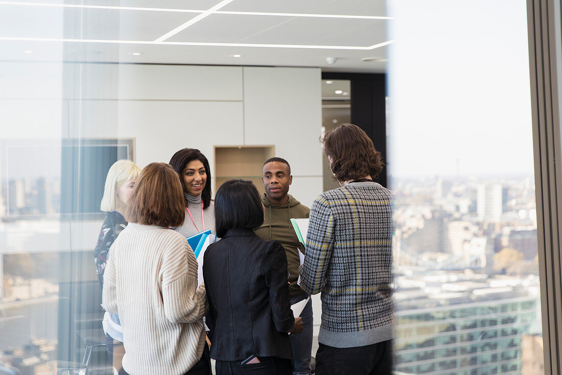 Business people talking in urban office meeting