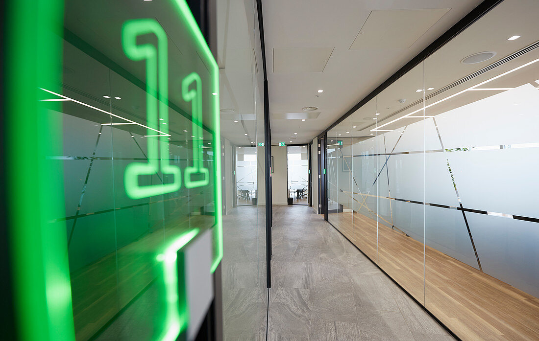 Neon sign in modern business office corridor