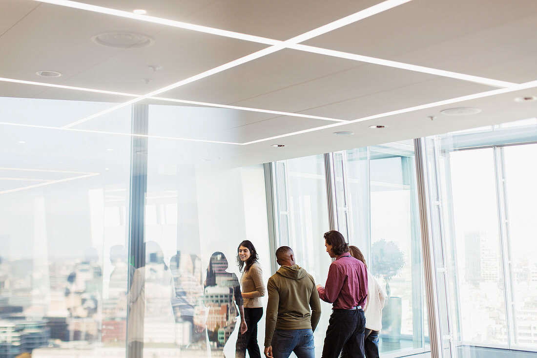 Business people talking in urban office