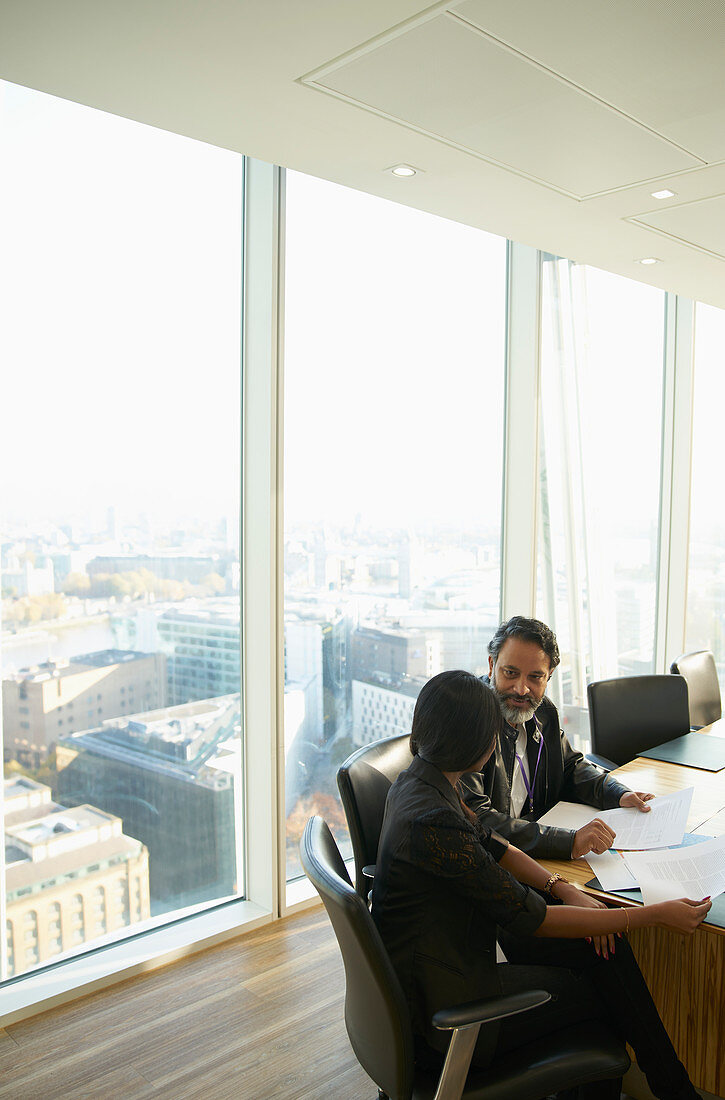 Business people discussing paperwork