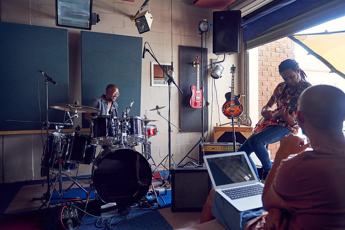 Musicians practicing in music recording studio