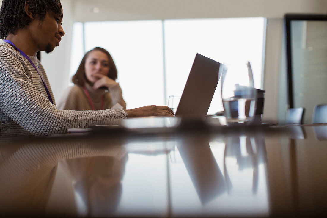 Business people planning at laptop