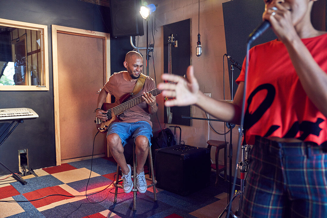 Musicians singing and playing guitar