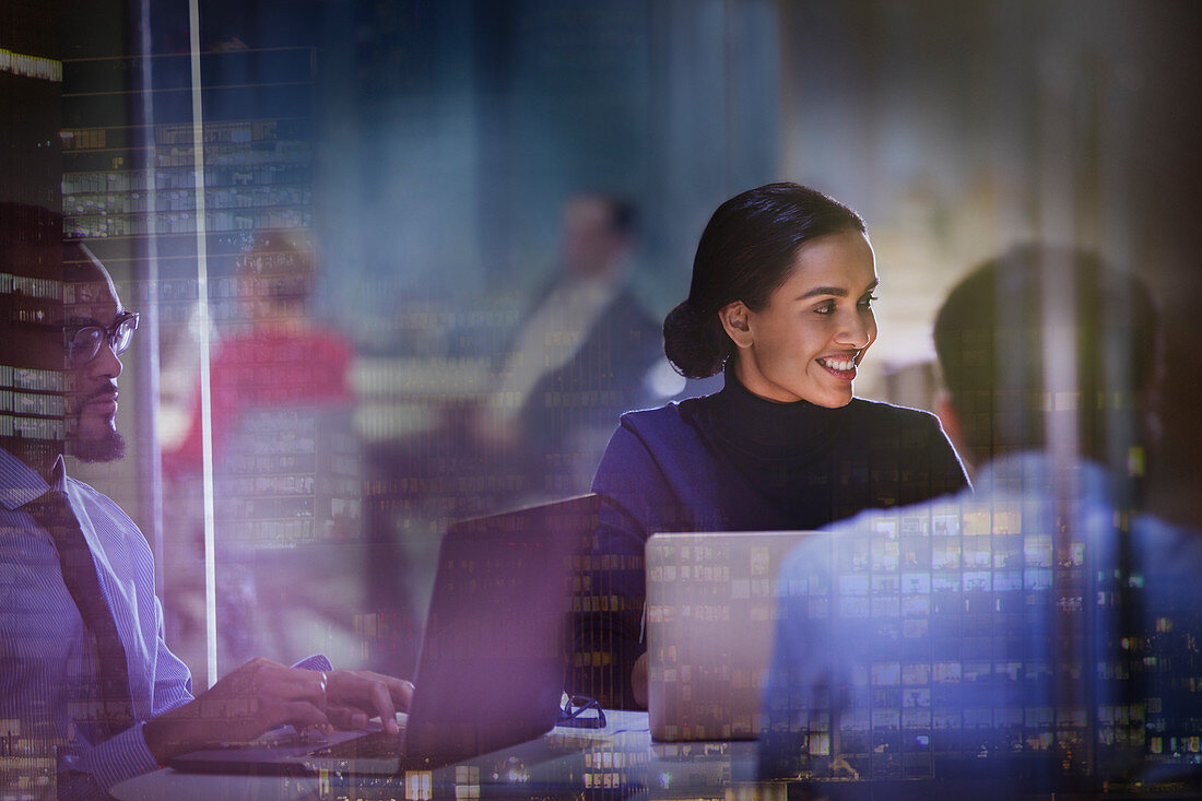 Smiling businesswoman at laptop