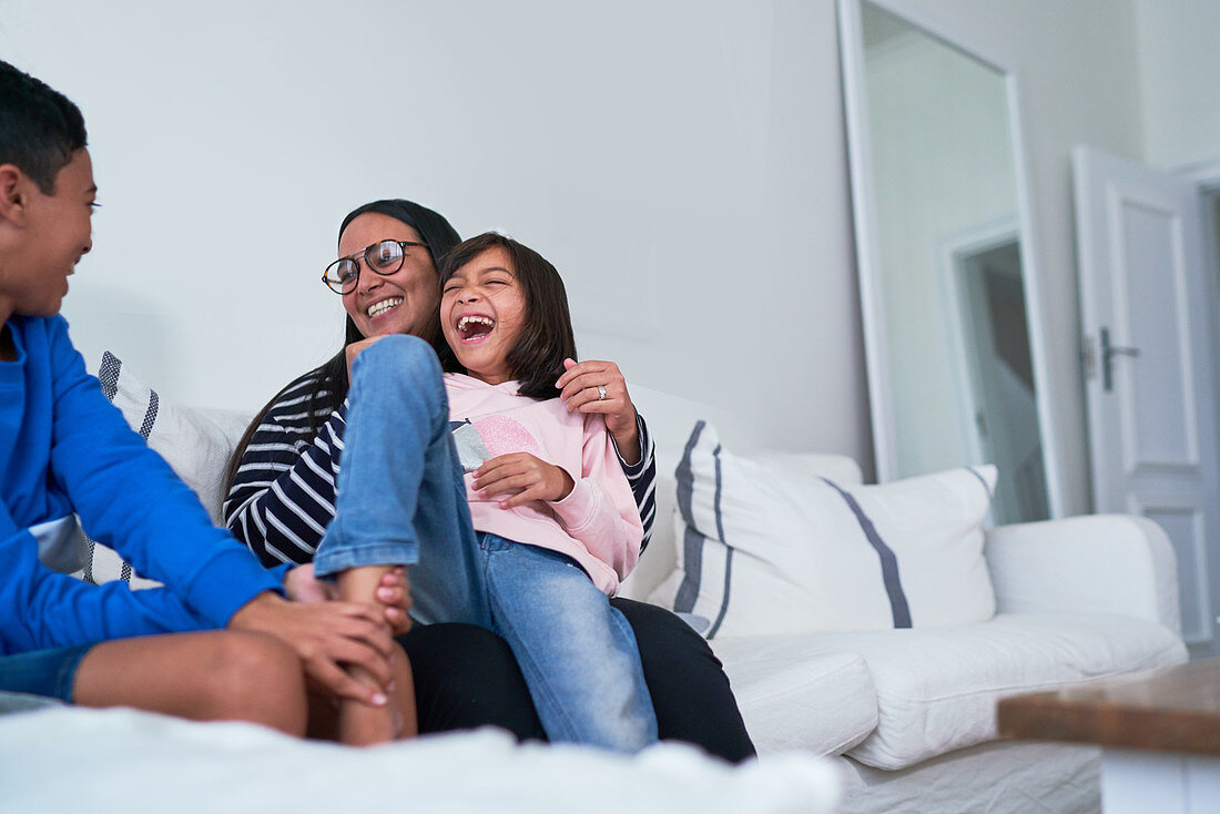 Happy family on living room sofa