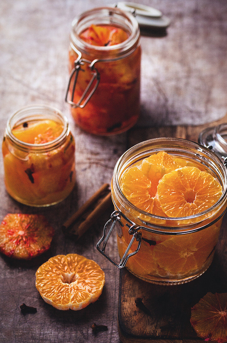 Preserved clementine and blood orange in jars