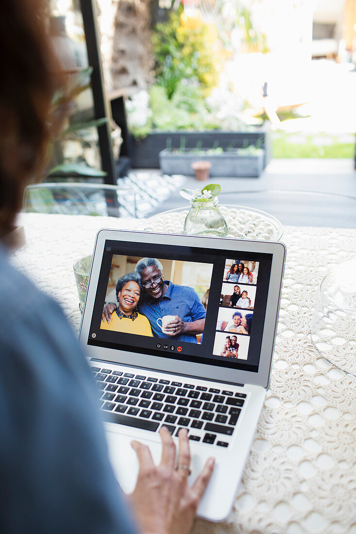 Woman video chatting with family and friends