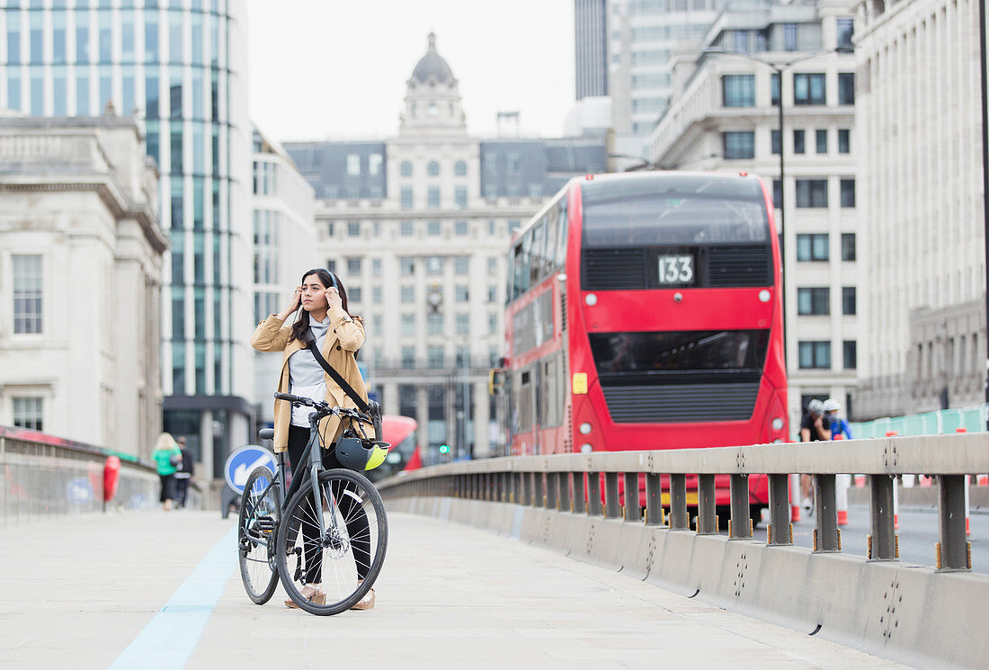 Businesswoman and bicycle, London, UK