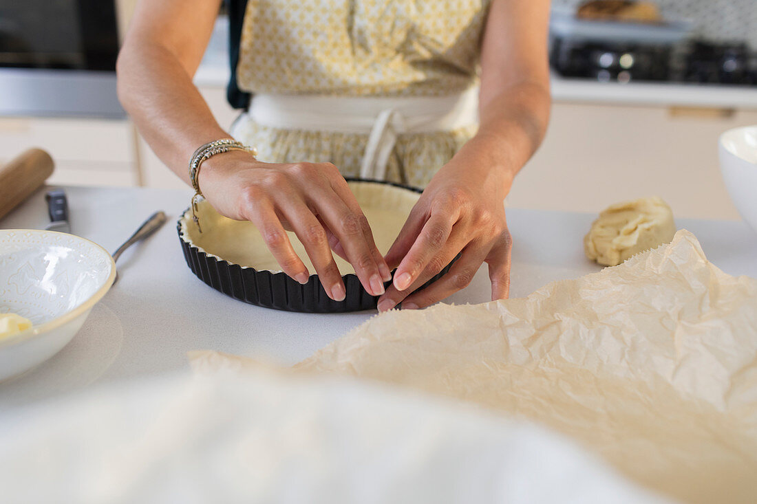 Woman baking preparing pie crust