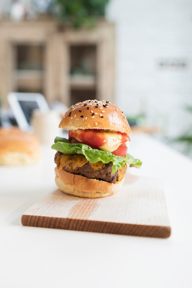 Close up cheeseburger slider on cutting board