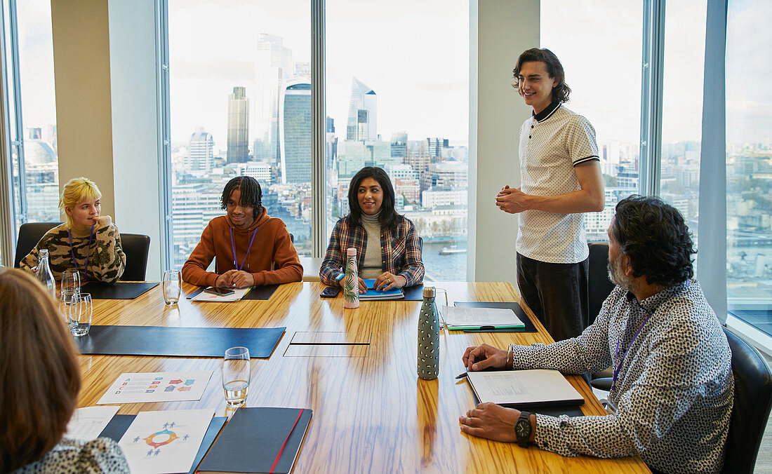 Businessman leading conference room meeting