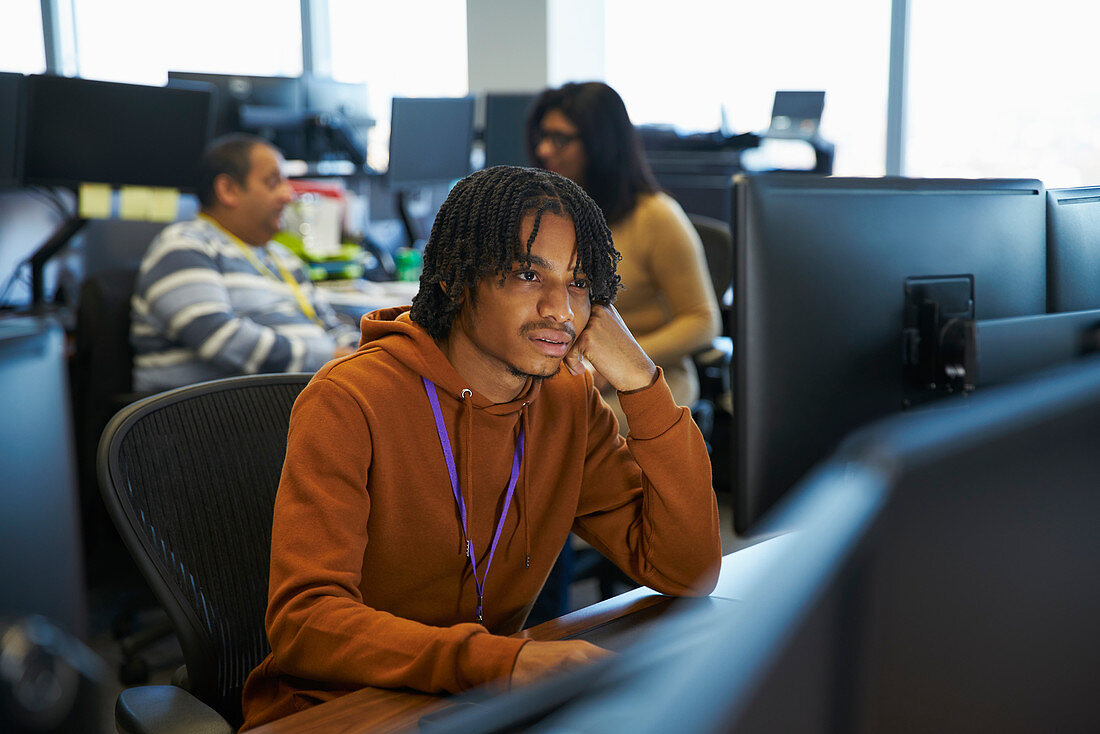 Businessman working at computer in office