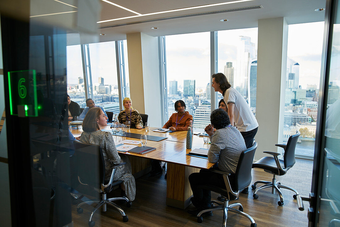 Businessman leading conference room meeting