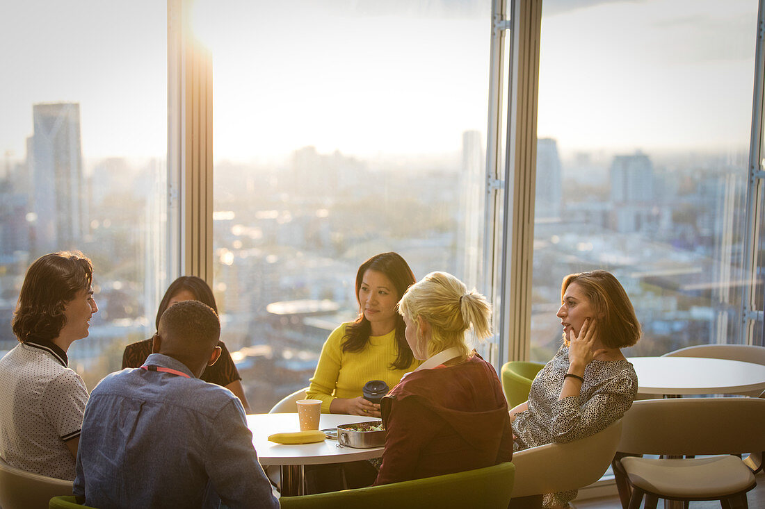 Business people talking cafeteria