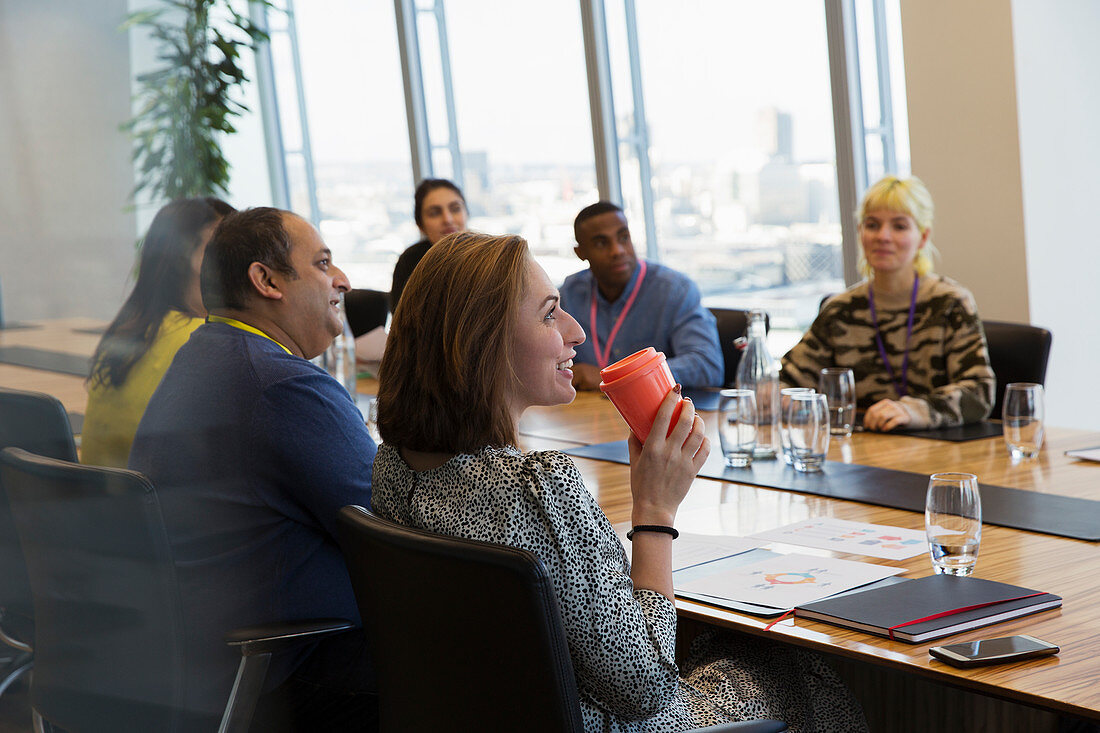 Businesswoman drinking coffee meeting