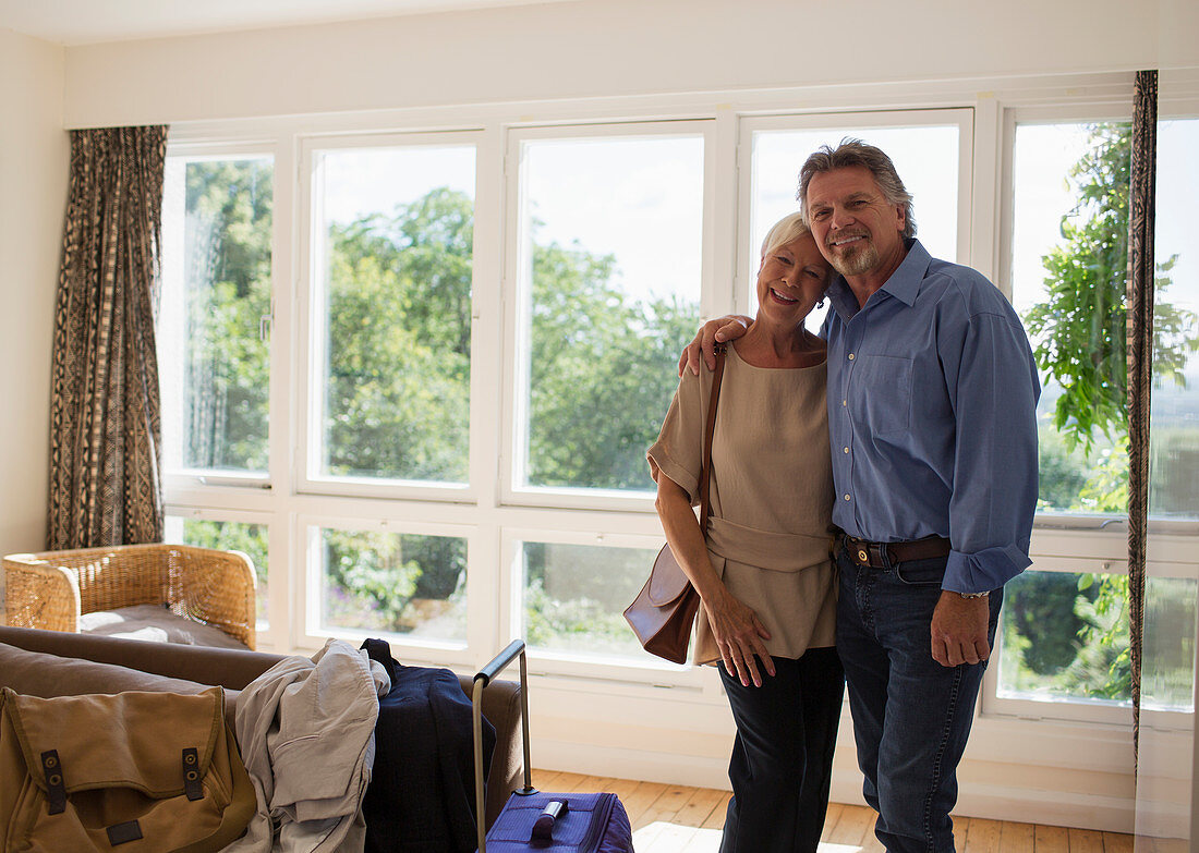 Senior couple arriving at house rental