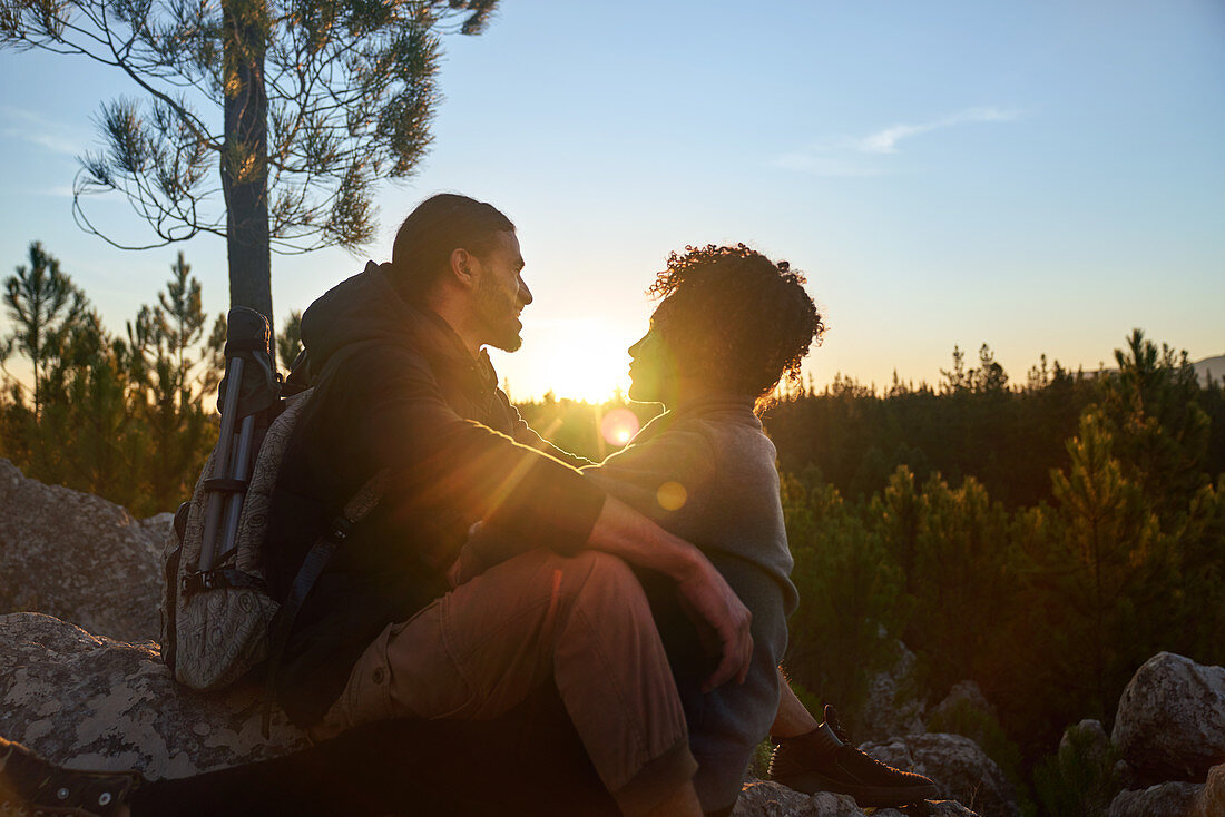 Couple enjoying tranquil sunset in woods