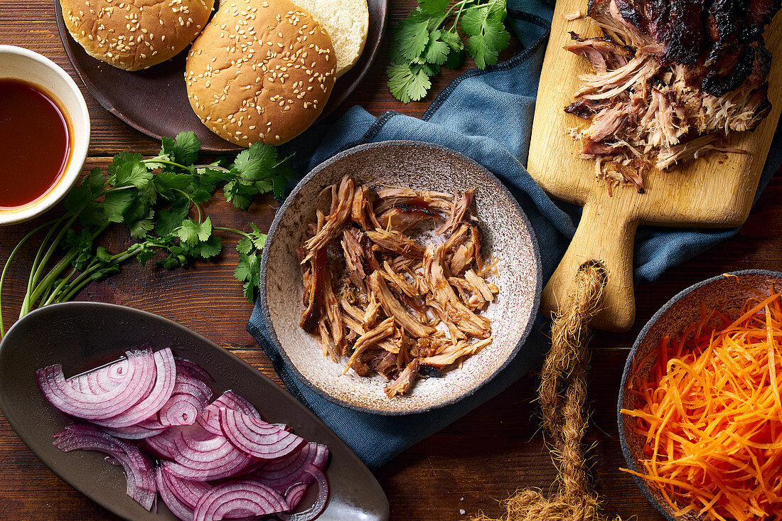 Slow roasted pulled pork with barbecue sauce and pickled vegetables and buns