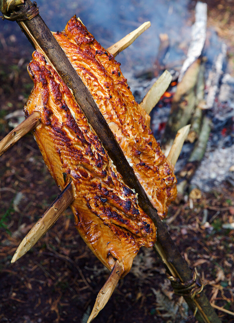 Salmon cooking over fire