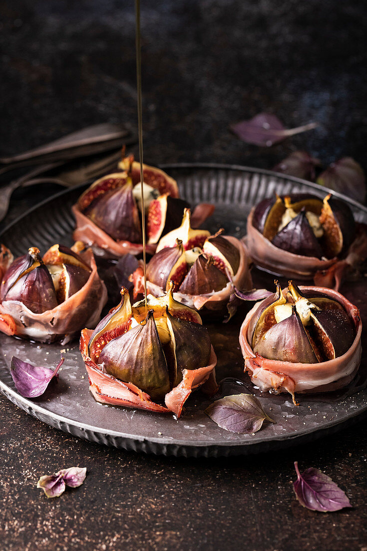 Figs baked with prosciutto, gorgonzola and maple syrup