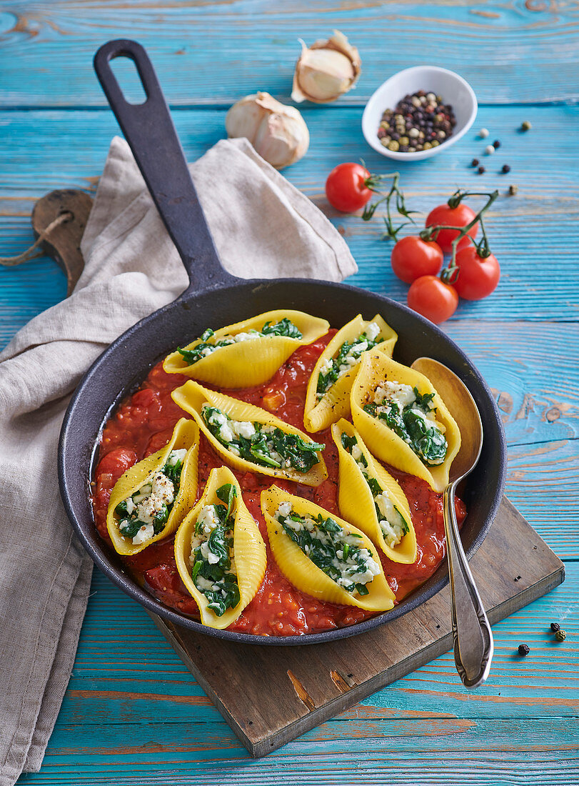 Baked pasta with tomato sauce and spinach