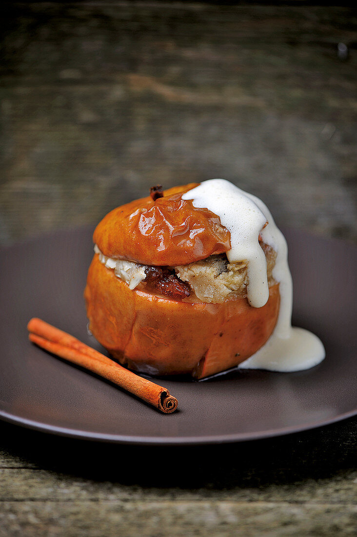 Filled baked apple with vanilla sauce