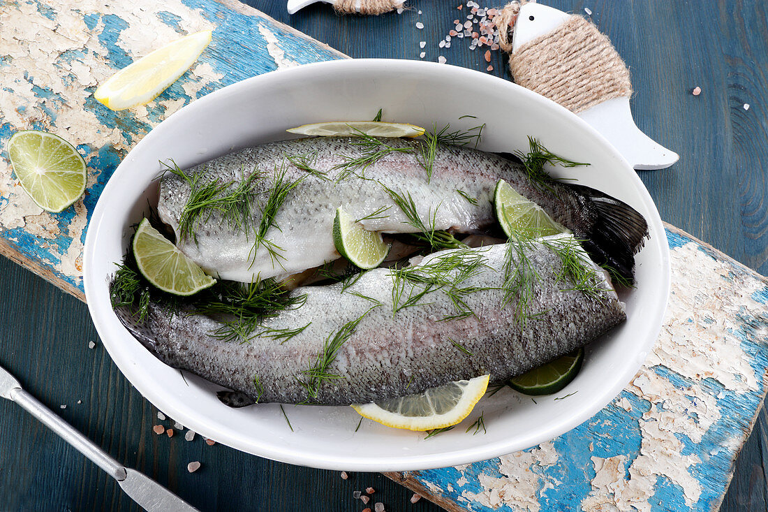 Fresh trout with lime and dill, prepared for baking