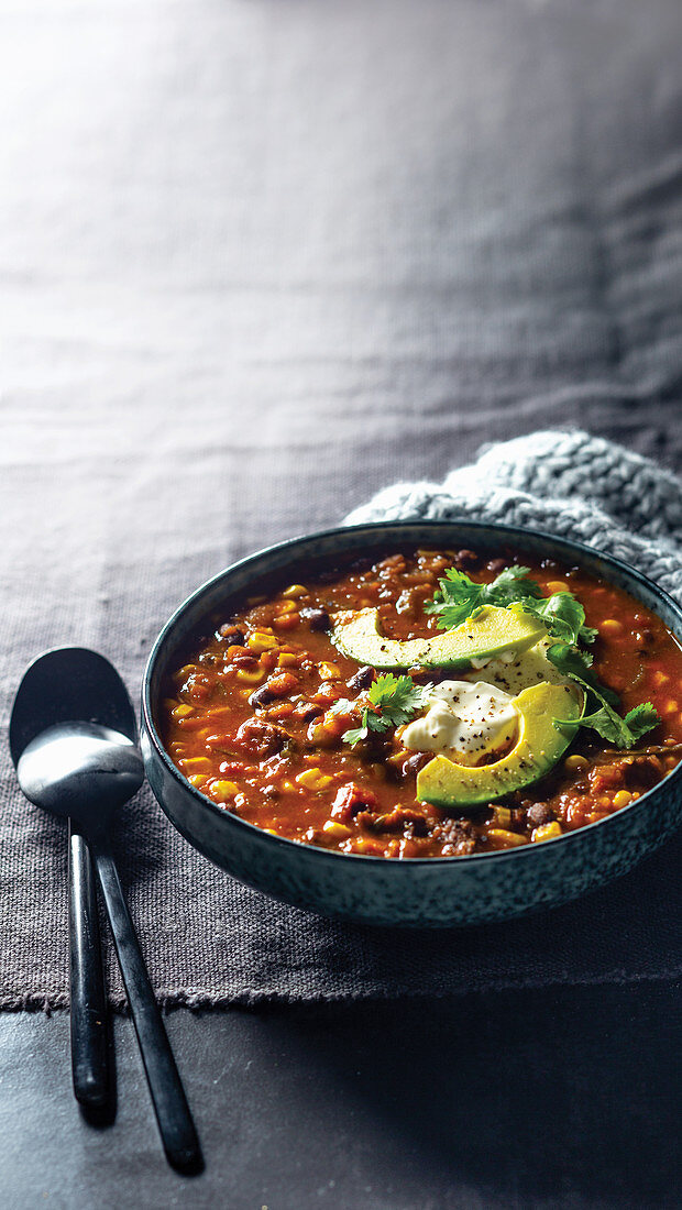 Mexican beef soup with avocado