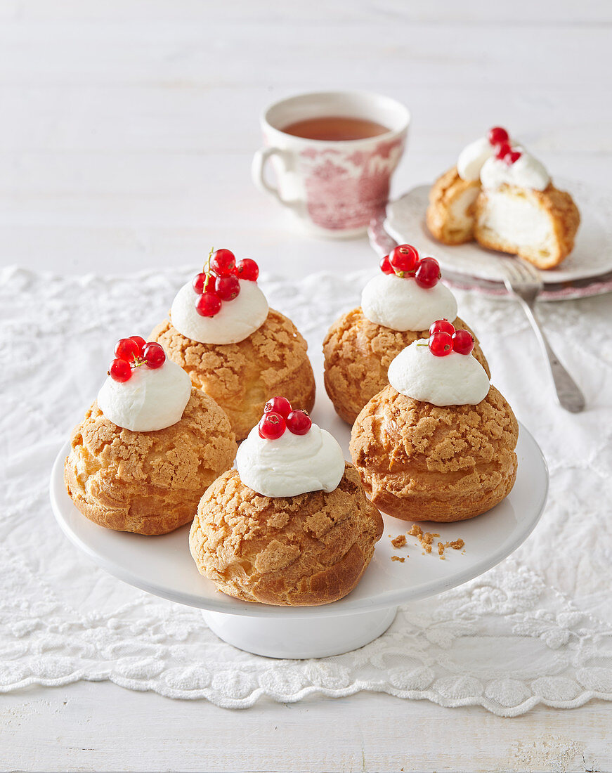 Buns with cream hat and currants
